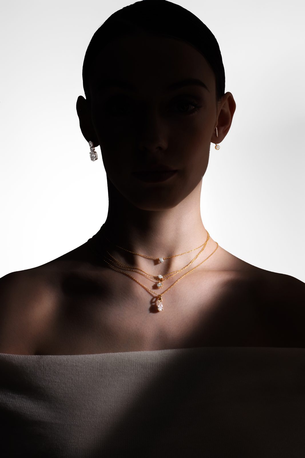 Bespoke diamond jewellery in dramatic light