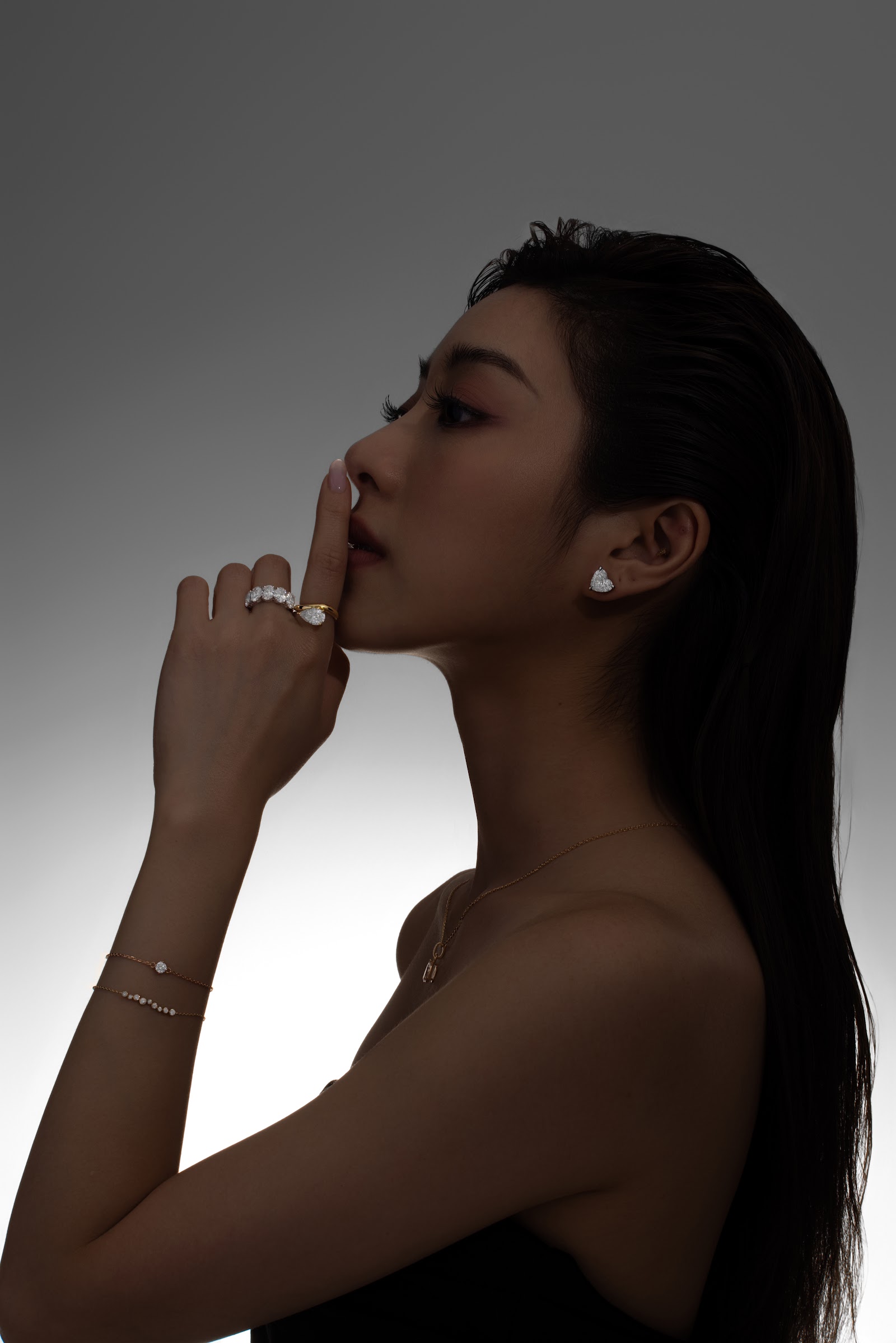 Profile portrait with heart-shaped diamond stud